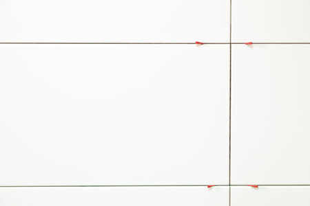 detail of measurement with laser beam at a bathjroom wall
