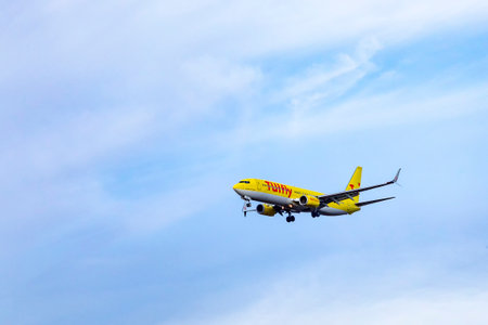 Frankfurt, Germany - April 4, 2019: Aircraft of TUI Fly in landing approach at Frankfurt international airport.のeditorial素材