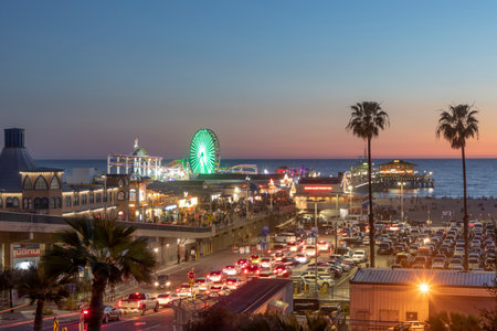 SANTA MONICA, USA - MAR 17, 2019: The Santa Monica Pier in Santa Monica, USA by night. The site is an iconic 100-year-old landmark for California visitors.のeditorial素材