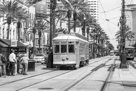 New Orleans, USA - July 16, 2013: People travel with the old street car Canal street line St. Charles line in New Orleans, USA. It is the oldest continually operating street car line in the world.のeditorial素材