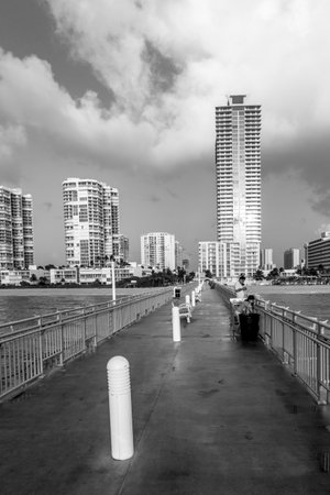 Sunny Isles Beach, USA - August 17, 2014: People catch fishes at the pier in Sunny Isles Beach, USA. In 1936, Milwaukee magnate Kurtis painted the Sunny Isles pier.のeditorial素材