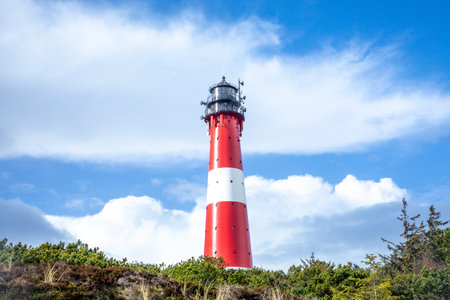 Hoernum, Germany - February 19, 2022: lighthouse of Hoernum on Sylt island, Germany. Landmark, tourist attraction and guiding light for navigation on the North Sea.のeditorial素材