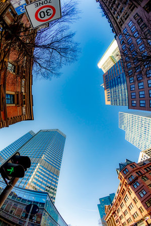 Frankfurt, Germany - February 8, 2023: fisheye perspective of skyscraper downtown financial district...