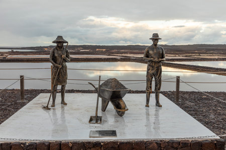 Janubio, Spain - January 30, 2023: statue sambolizing the worker at the salt mine in Janubio, Lanzarote.のeditorial素材