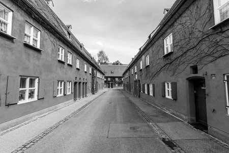 AUGSBURG, GERMANY - APRIL 29, 2015: The Fuggerei is the worlds oldest social housing complex still...