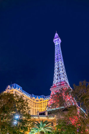 Las Vegas, USA - March 10, 2019: the replica of the eiffel tower at the strip is illuminated by night in Las Vegas.のeditorial素材