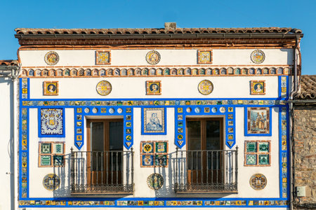Caceres, Spain - August 8, 2022: scenic view to house facade with colorful tiles and iron balcony in Caceres, Spain.のeditorial素材