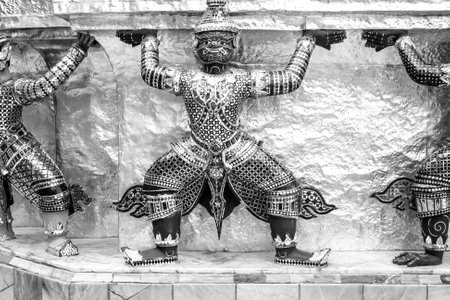 Bangkok, Thailand - December 26, 2007: guard dressed as demon carrying the temple wall in the4 grand palace in Bangkok, Thailandのeditorial素材