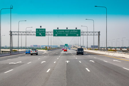 Bangkok, May 6, 2009: the highway from the Bangkok airport to downtown is a toll highway. Seen from taxi with sun protection at windshield.のeditorial素材