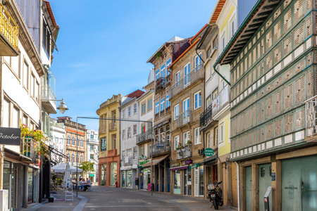 Braga, Portugal - May 1, 2023: street scene in the old town of Braga with historic facades and...