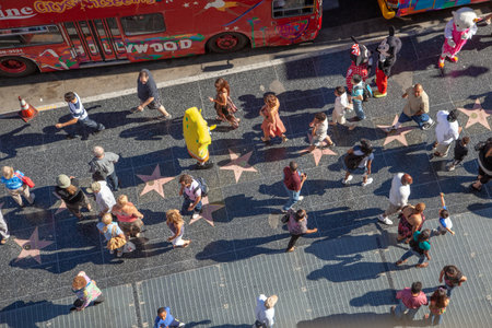 Los Angeles, USA - June 24, 2012: tourists enjoy walking at the walk of fame, the hollywood...
