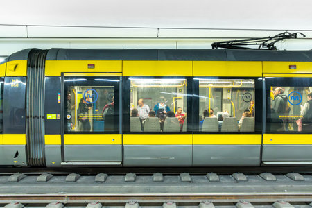 Porto, Portugal - May 3, 2023: metro stops at metro station faria guimaraes with modern metro in...