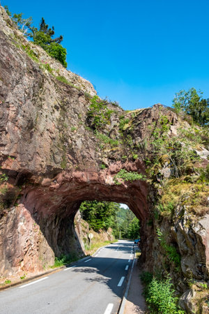 scenic, devils rock iwith street tunnel n the vosges region of france, europeの写真素材