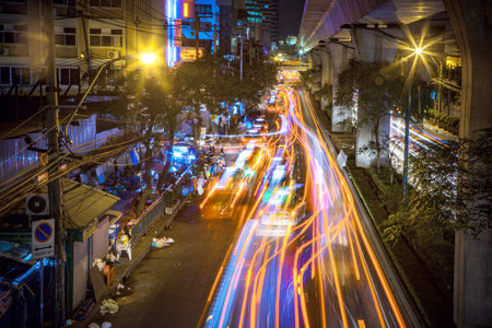Bangkok, Thailand - December 21, 2009: cars at sukhumvit road by night stop and go with long exposure effect.のeditorial素材