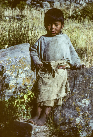 Taquile, Peru - February 7, 1985: portrait of local young boy in traditonal way linen at island Taquile in lake Titicaca.のeditorial素材