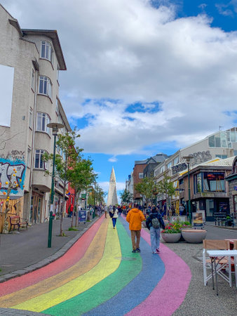 ReykjavÃ­k, Iceland - July 13, 2023: The Gay Pride rainbow from SkÃ³lavÃ¶rÃ°ustÃ­gur street, one of the busiest streets leading to Hallgrimfrikja church. Once painted for Reykjavik Pride week, now permanentのeditorial素材