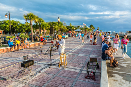 Key West, USA - August 26, 2014: people enjoy the sunset point at Mallory square in Key West, USA. This place is the most popular sunset point in Key West.のeditorial素材