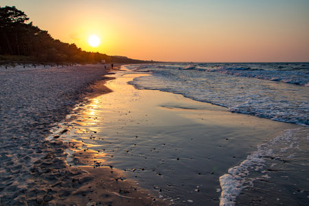 scenic sunset at the sandy beach in Usedom, Baltic sea