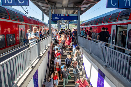 Wurzburg, Germany - September 11, 2013: People at Wurzburg train station wait for the train. Most of them hold a 49 Euros reduced Germany ticket.のeditorial素材