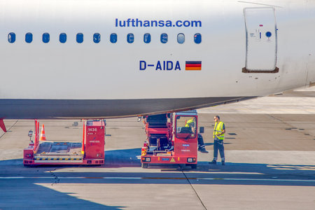 Hamburg, Germany - July 17, 2014: Ground operation personnel has a short break and stall while...