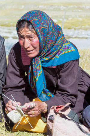 Leh, India - September 18, 2014: Portrait of sitting local woman in traditional costume near Leh in Ladakh province in India.のeditorial素材
