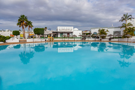 Playa Blanca, Spain - November 18, 2014: new harbor area in Playa Blanca with pool, hotels, restaurants and shops.のeditorial素材