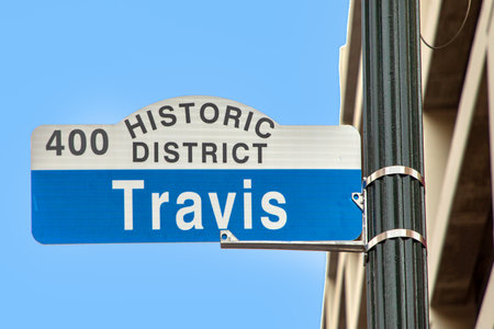 Street sign Travis in downtown Houston, Texas, USAの写真素材