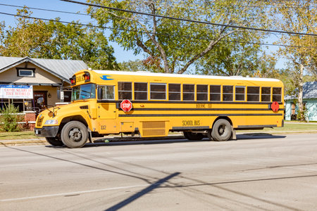Boerne, USA - November 2, 2023: School buses on the way in Boerne, Texas, USA. School buses are free...