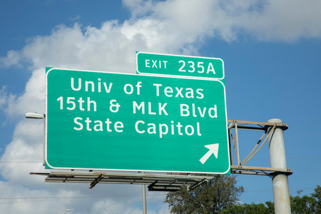 exit University of Texas and State Capitol in Austin from interstate 35 in afternoon sun with cloudsの写真素材
