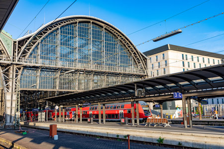 Frankfurt, Germany - September 11, 2013: People at Frankfurt train station arrive with a local red train. Most of them hold a 49 Euros reduced Germany ticket.のeditorial素材