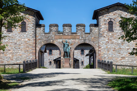 Bad Homburg, Germany - August 16, 2024: The main gate of the Roman fort Saalburg near Frankfurt, Germany with statue of Augustus.. The fort was erected to guard the limes wall.のeditorial素材