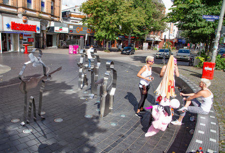 Hamburg, Germany - July 30, 2016: people at the statue of the beatles at beatles square in Sankt Pauli, the amusement quarter of Hamburg.のeditorial素材