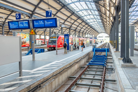 Wiesbaden, Germany - August 22, 2024: people waiting for train in historic classicistic train station in Wiesbaden, Germany.のeditorial素材