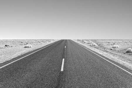 driving on the Interstate 187 in Death valley towards Badwater in the heat of the Mojave Desertの写真素材