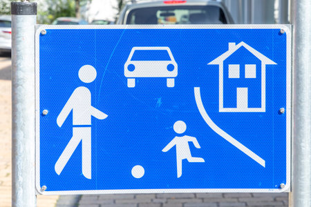 Sindelfingen, Germany - August 29, 2024: Signage children playground with icons of soccer playing children at the street to reduce speed of cars to walking speed..のeditorial素材