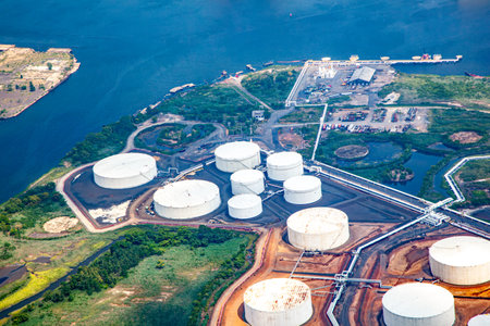 Oil farm with river and ship on pier in Newark, New Yorkの写真素材