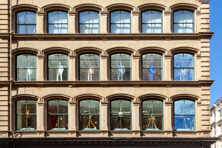 New York, USA - July 9, 2010: Naked puppets in the windows of an old historic facade in New Yorkのeditorial素材