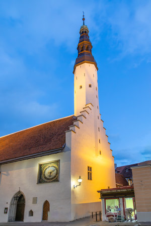 Church of the Holy Spirit in the old town in Tallinn in Estonia in Eastern Europe. Old clock on the buildingの写真素材