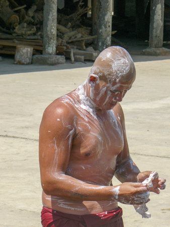 Inle Lake, Myanmar - April 29, 2007: Monk uses soap for cleaning at the pagoda and cutting his hair.のeditorial素材