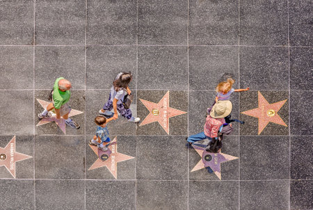 Los Angeles, USA - July 5, 2008: People passing the walk of fame in Hollywood on a sunny day in Los Angeles, Hollywood, USA.のeditorial素材