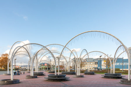 Tallinn, Estonia - October 27, 2024: Diffrent town names written on the concrete. Lots of cool arc shapes and nice shadows from them. Public airport tram stop waiting area with out any people.のeditorial素材