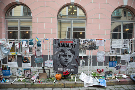 Tallinn, Estonia - October 25, 2024: poster and political statements about the murdering of Alexey Navalny at a fence at the Russian embassy in Tallinn.のeditorial素材