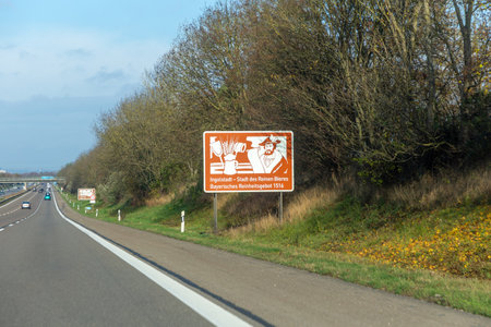 brown signage at the highway in Germany for information and advertising to visit the landmark Ingolstadt, city of beer at this area in Bavaria, Germanyの写真素材