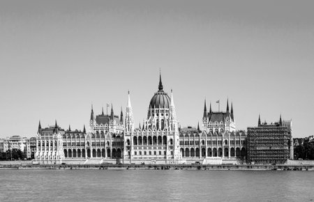 famous Hungarian parliament in Budapest with river Danubeの写真素材