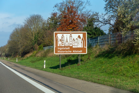 brown signage at the highway in Germany for information and advertising to visit the landmark Ingolstadt, old town at this area in Bavaria Germanyの写真素材