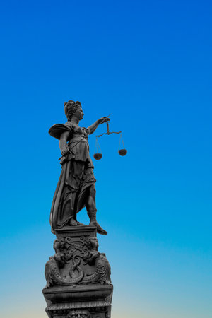 Frankfurt, Germany - January 9, 2019: silhouette of Lady Justice at the fountain at Romerberg in Frankfurt, Germanyの写真素材