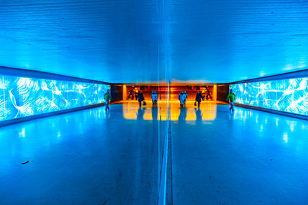 large tunnel for pedestrians in blue cool lightの写真素材