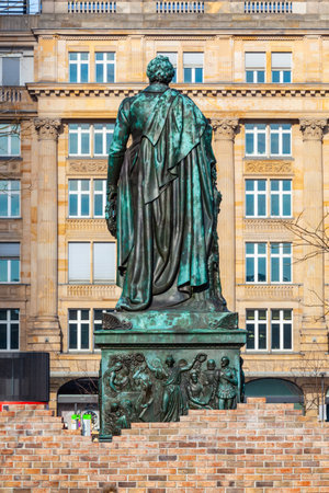 backside view of statue of Johann Wolfgang von Goethe in Frankfurt at Goethe squareの写真素材