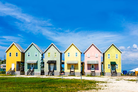 Beautiful tourist huts at the beach in Dauphin Island, USA.の写真素材