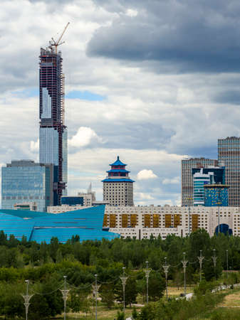 Abu Dhabi Plaza is a development under construction in Nur-Sultan, Kazakhstan, consisting of office, residential, hotel and serviced apartment blocks set on a retail podium and below ground basement levels. When completed, 1253 ft tall main tower will be のeditorial素材